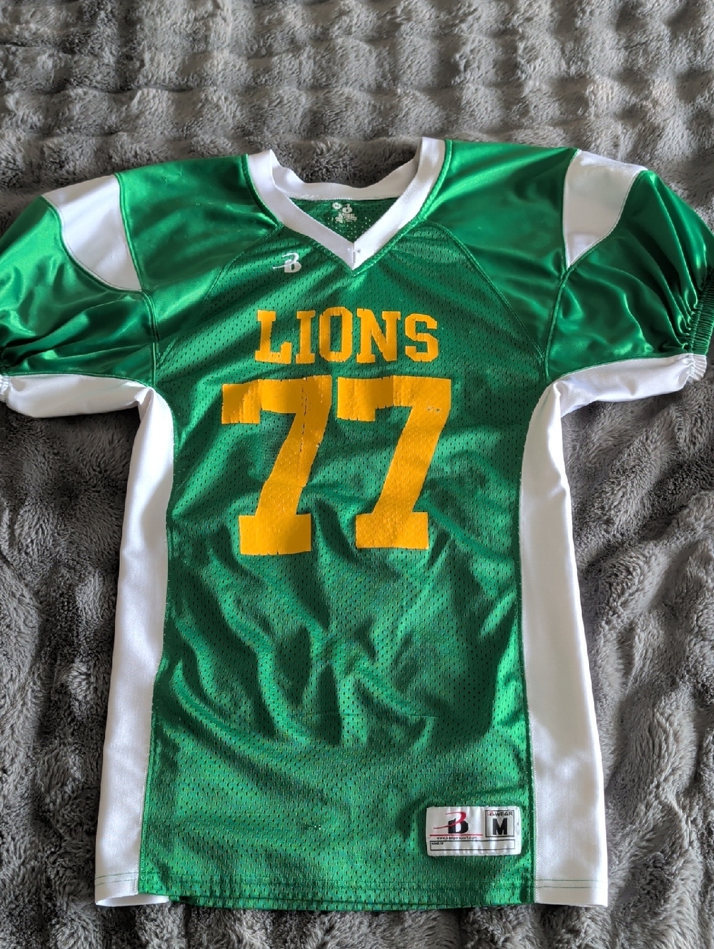 Green "LIONS" Football Jersey with Yellow Numbers